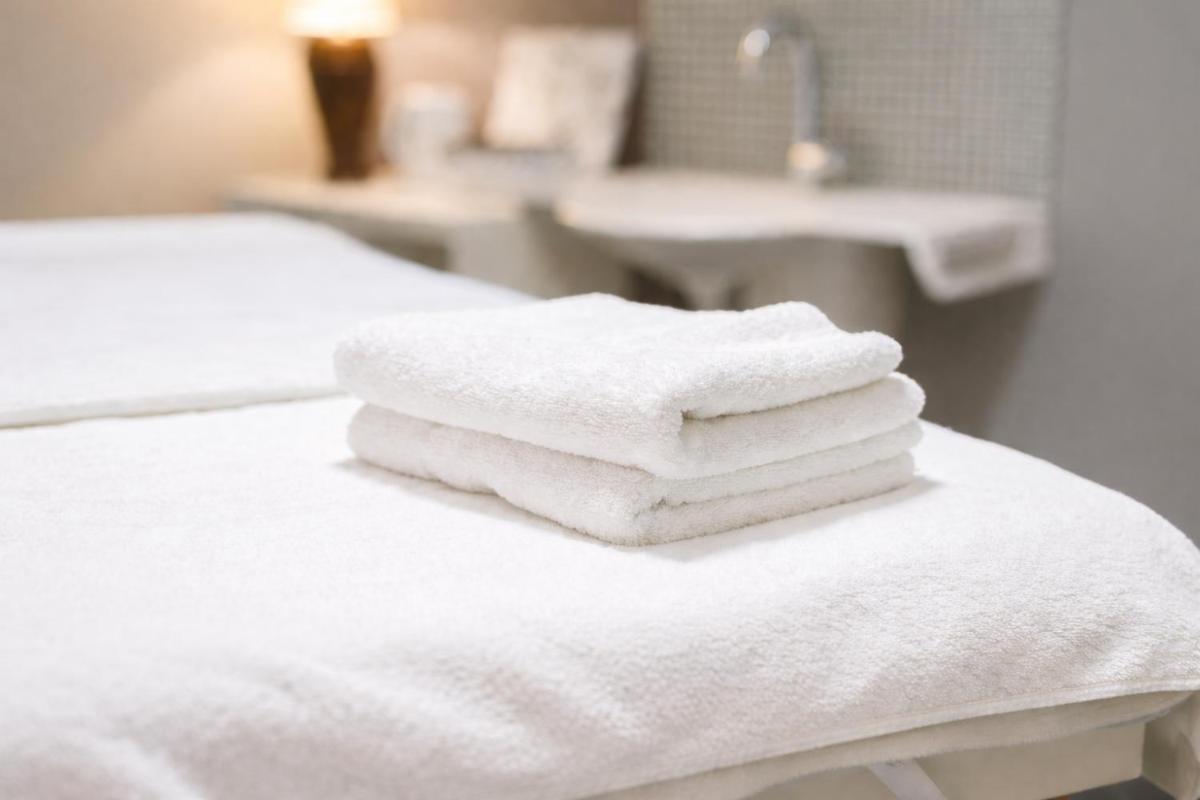 Un ou plusieurs lits dans un hébergement de l'établissement Hotel Europa