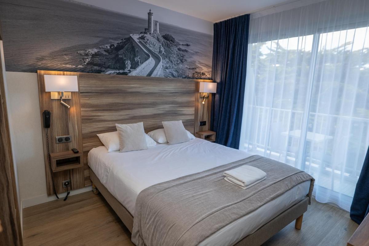 Un ou plusieurs lits dans un hébergement de l'établissement Hotel Europa