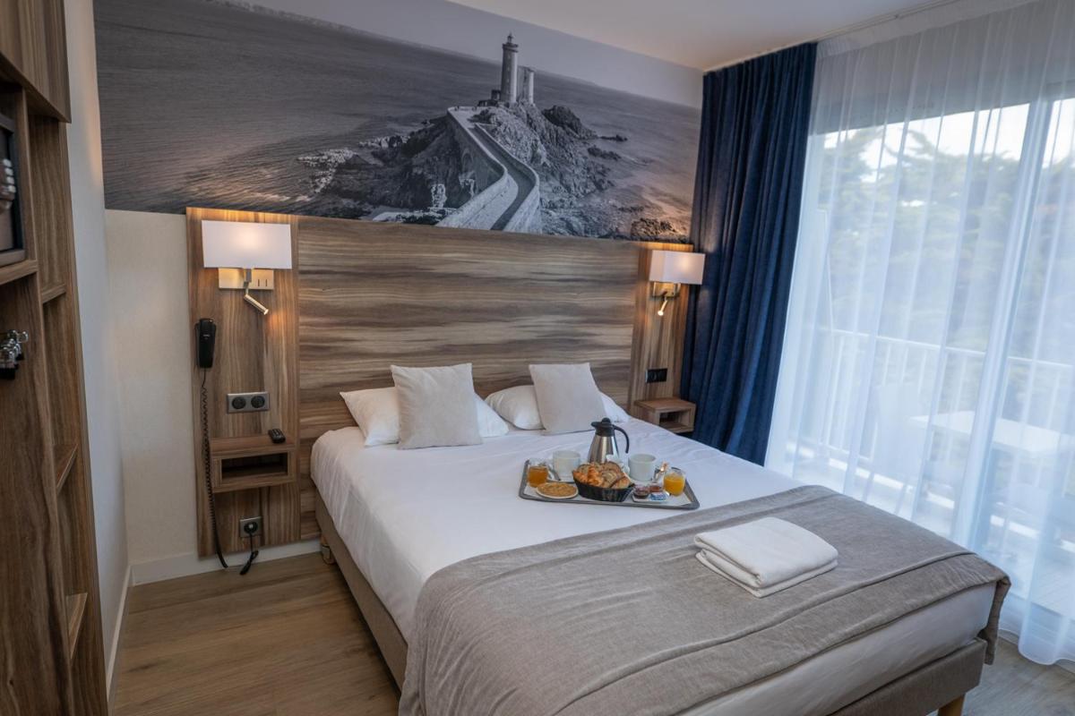 Un ou plusieurs lits dans un hébergement de l'établissement Hotel Europa