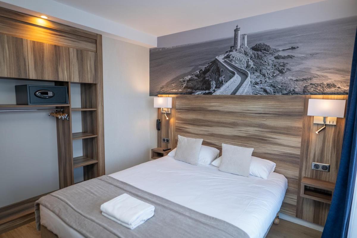 Un ou plusieurs lits dans un hébergement de l'établissement Hotel Europa