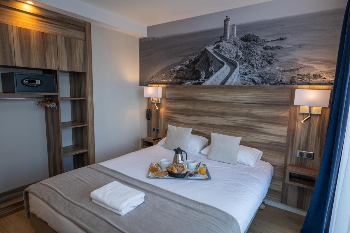 Un ou plusieurs lits dans un hébergement de l'établissement Hotel Europa