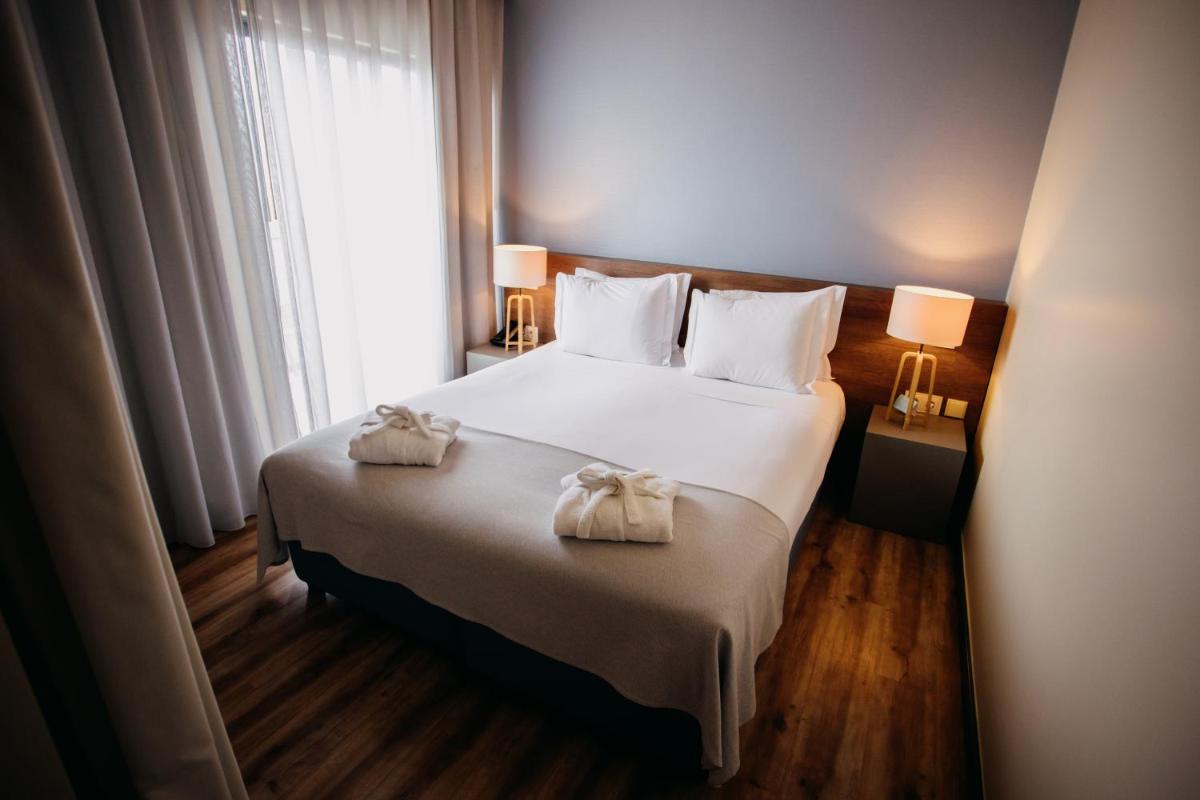 Uma cama ou camas num quarto em The Prime Energize Hotel & SPA - Algarve