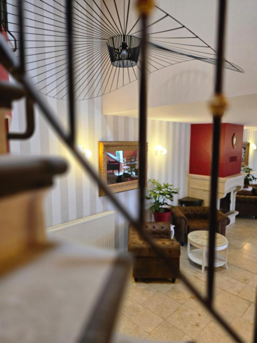 Coin salon dans l'établissement CÉRÈS - Boutique-Hôtel & Spa