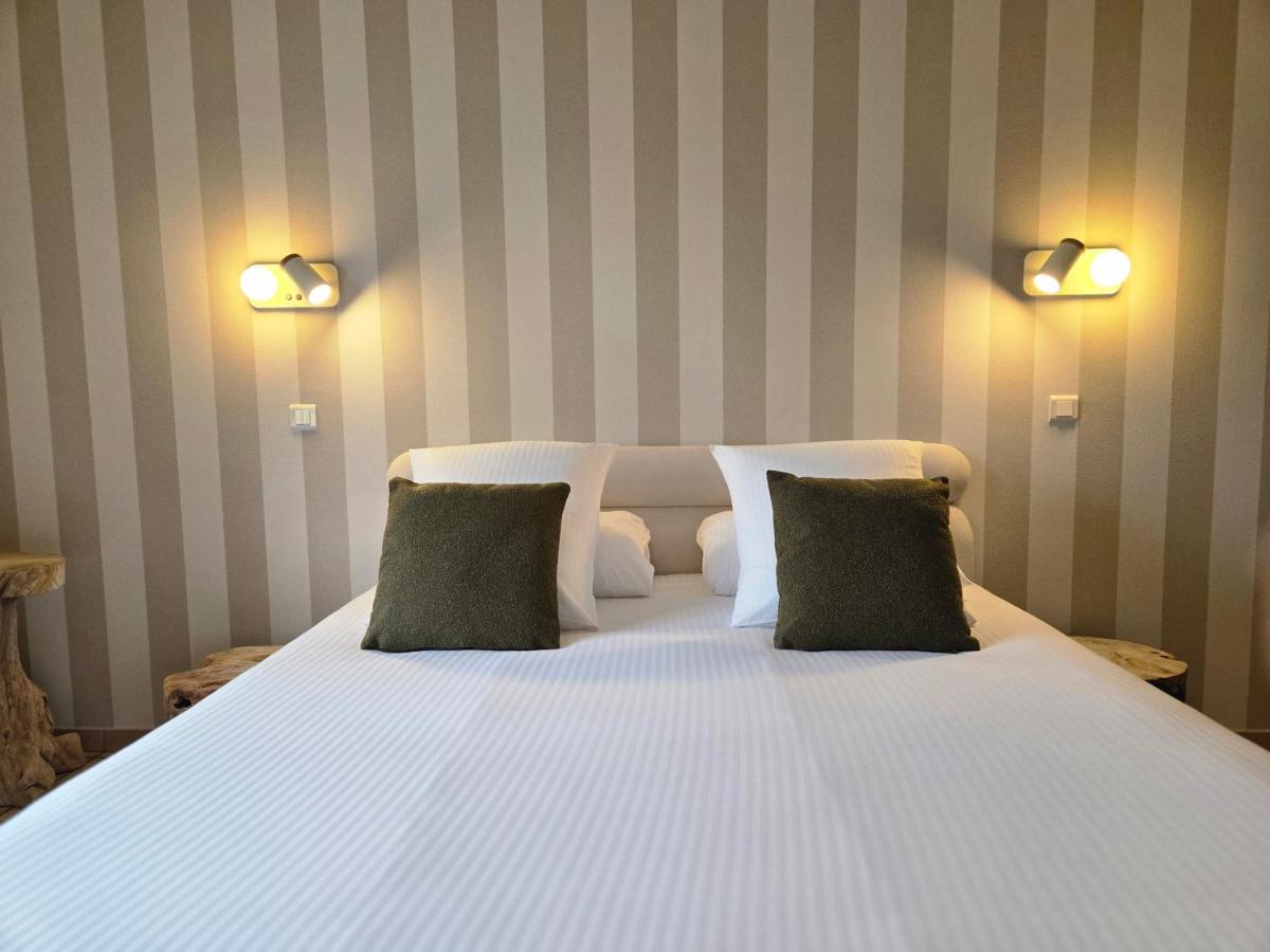 Un ou plusieurs lits dans un hébergement de l'établissement CÉRÈS - Boutique-Hôtel & Spa