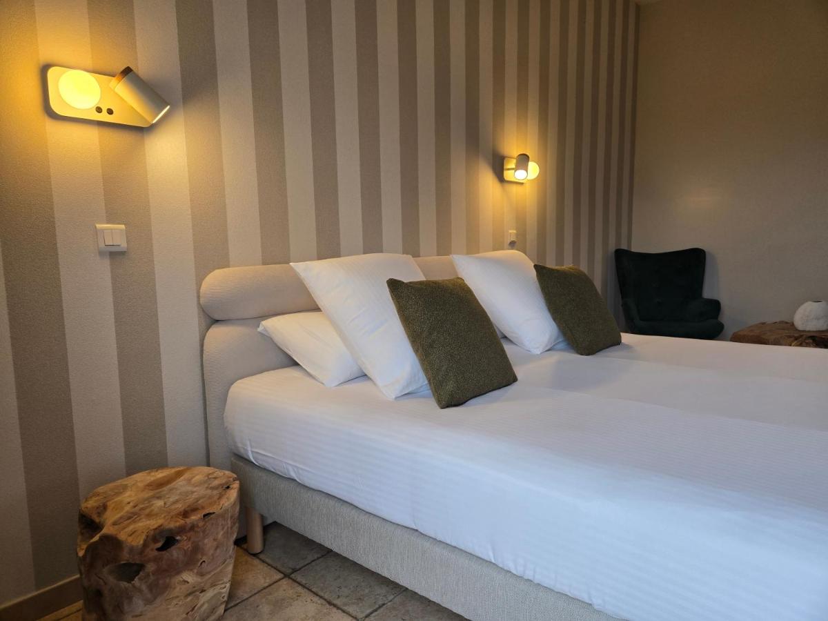 Un ou plusieurs lits dans un hébergement de l'établissement CÉRÈS - Boutique-Hôtel & Spa