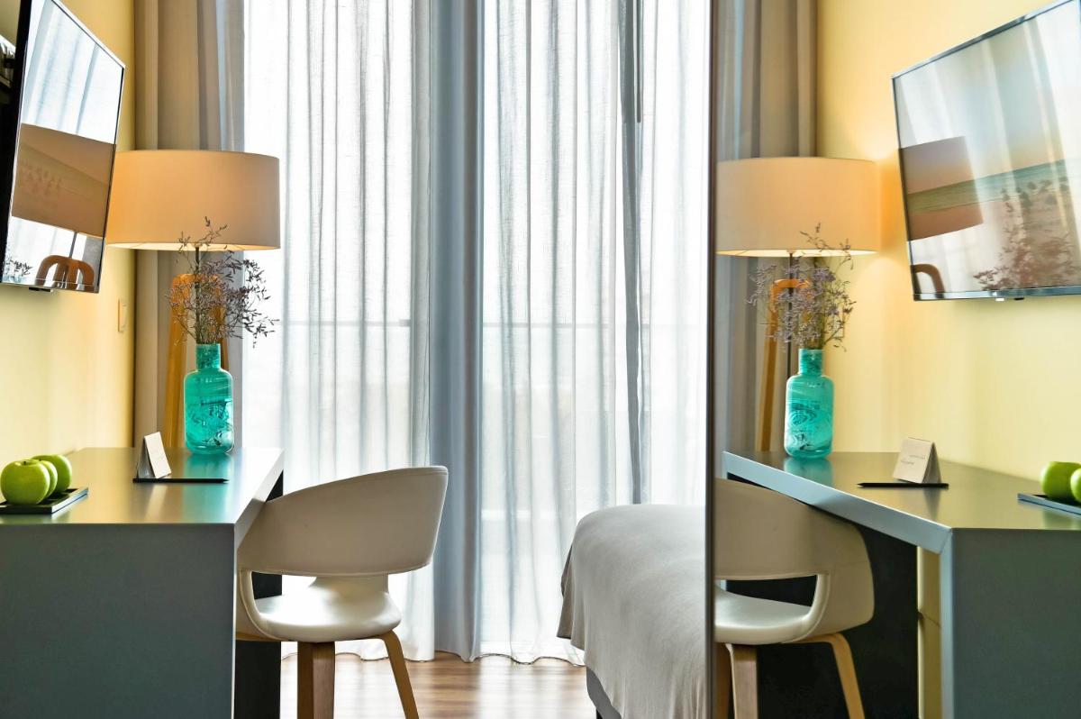 Uma televisão e/ou sistema de entretenimento em The Prime Energize Hotel & SPA - Algarve