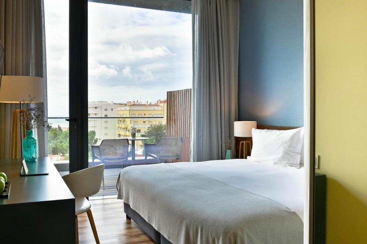 Uma cama ou camas num quarto em The Prime Energize Hotel & SPA - Algarve
