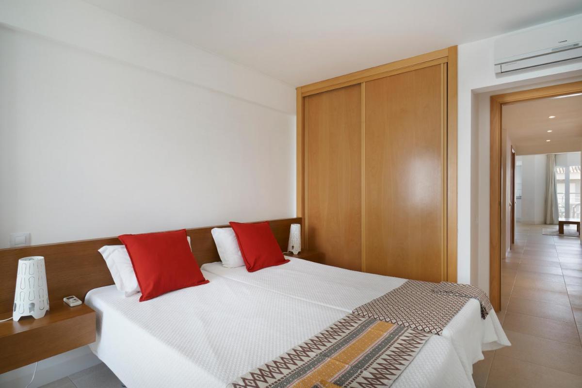 Uma cama ou camas num quarto em Golden Club Cabanas