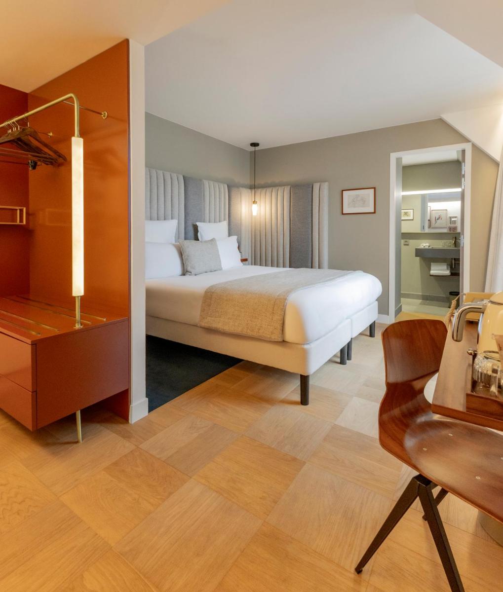 Un ou plusieurs lits dans un hébergement de l'établissement Hôtel Pilgrim