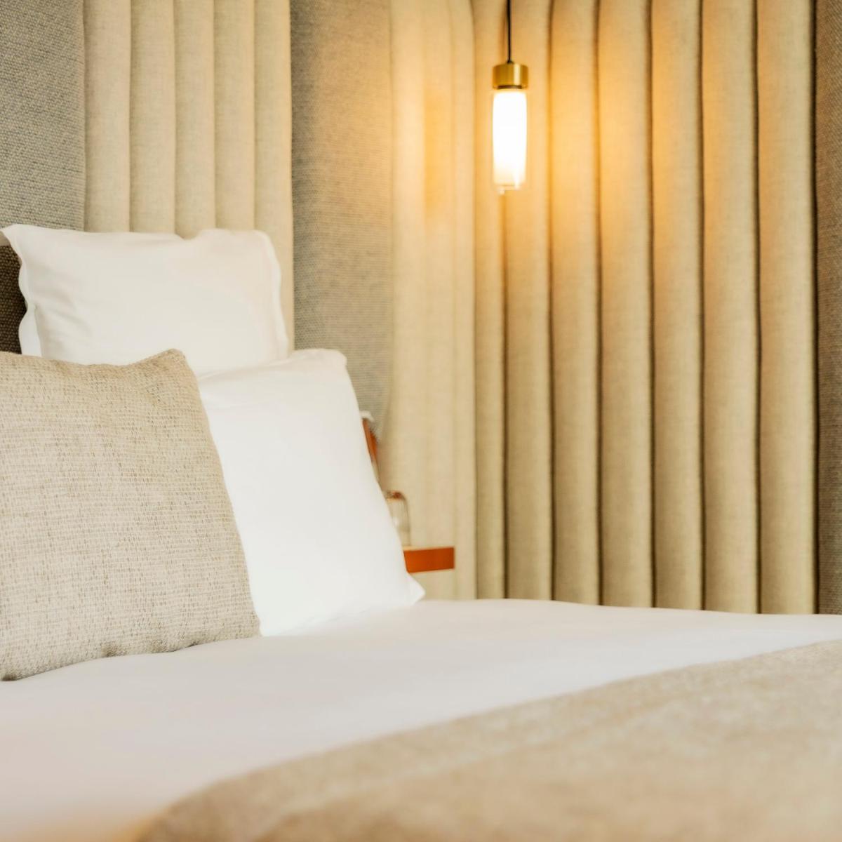 Un ou plusieurs lits dans un hébergement de l'établissement Hôtel Pilgrim