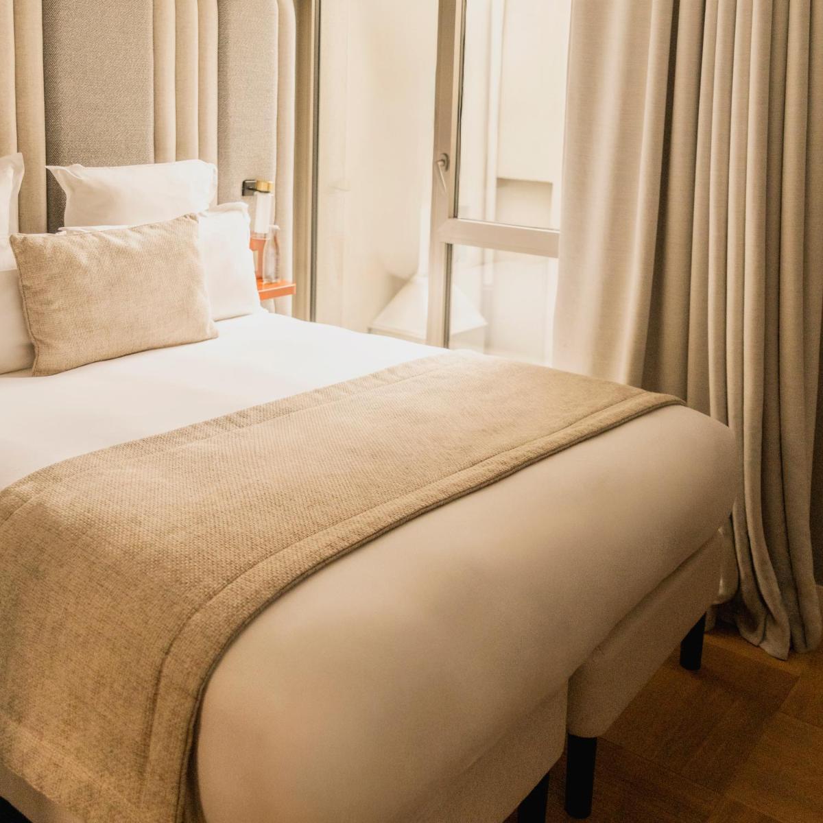 Un ou plusieurs lits dans un hébergement de l'établissement Hôtel Pilgrim