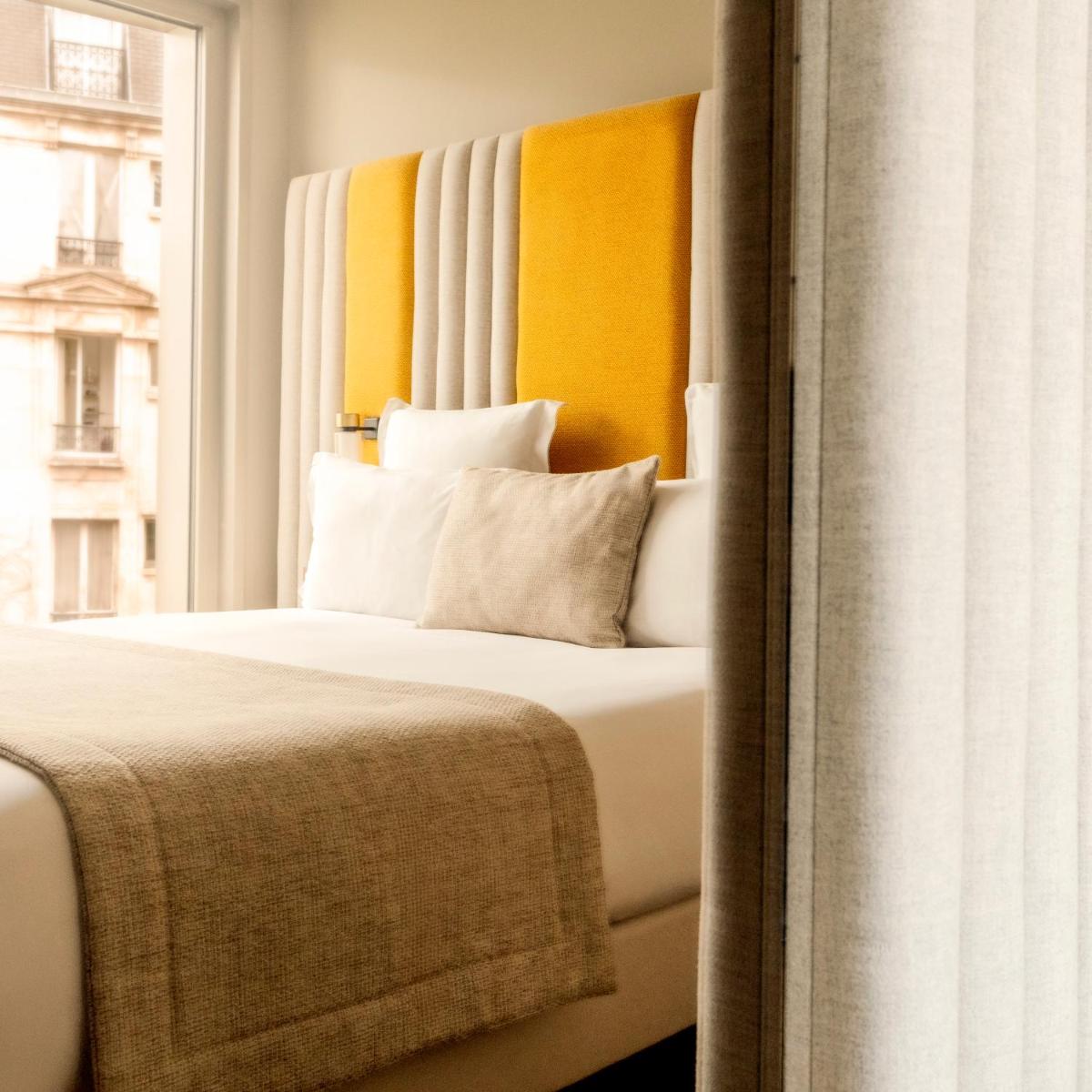 Un ou plusieurs lits dans un hébergement de l'établissement Hôtel Pilgrim