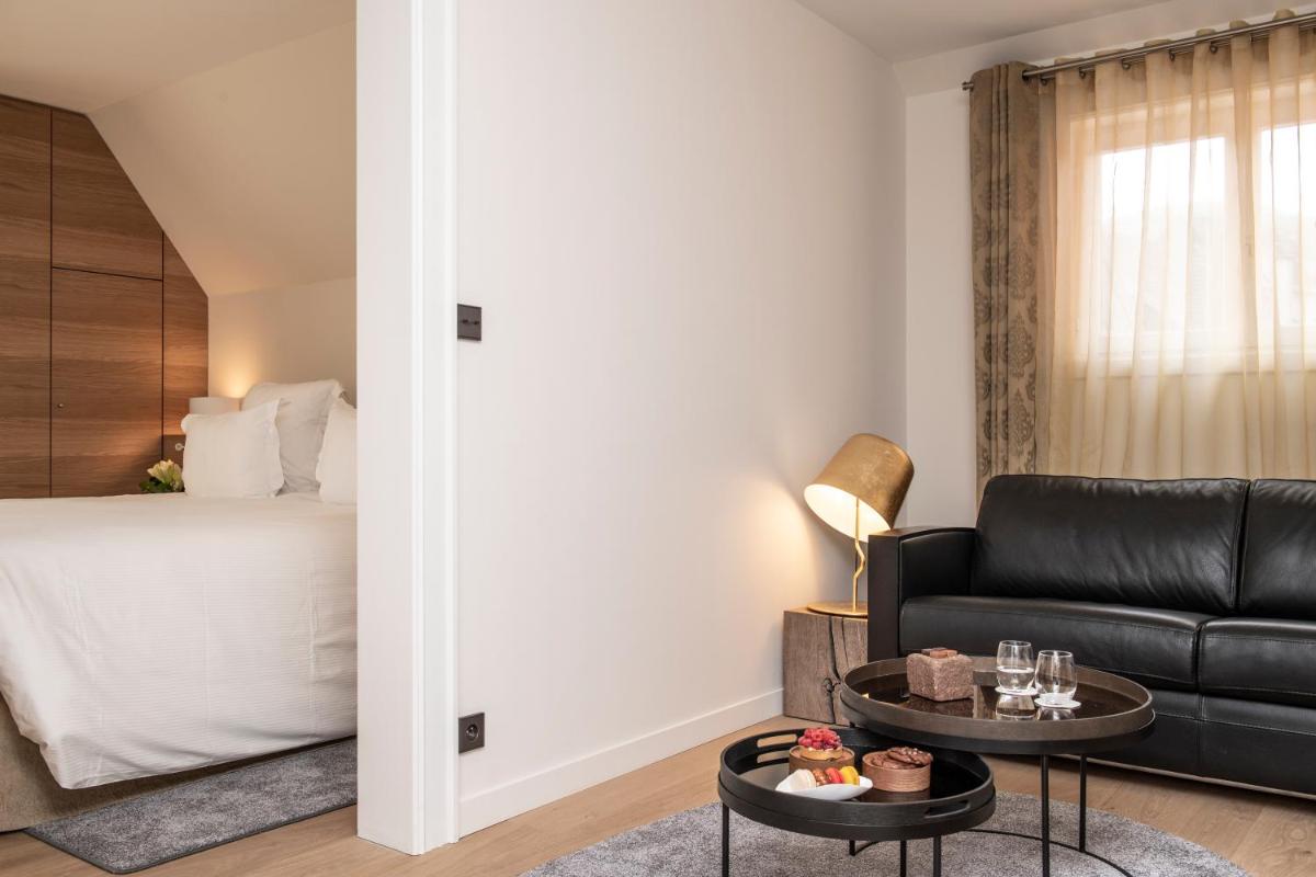 Un ou plusieurs lits dans un hébergement de l'établissement Relais et Châteaux Le Chambard