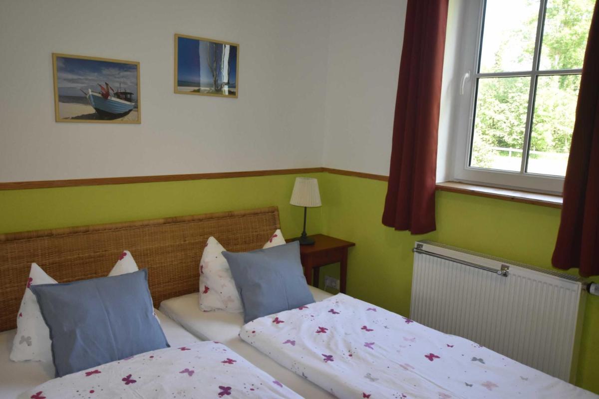 Ferienwohnung OG im roten Haus am Ostsee Radweg OVS 103 - Housity