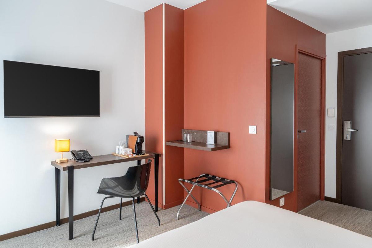 Télévision ou salle de divertissement dans l'établissement BW Plus Central Park Hotel & Spa