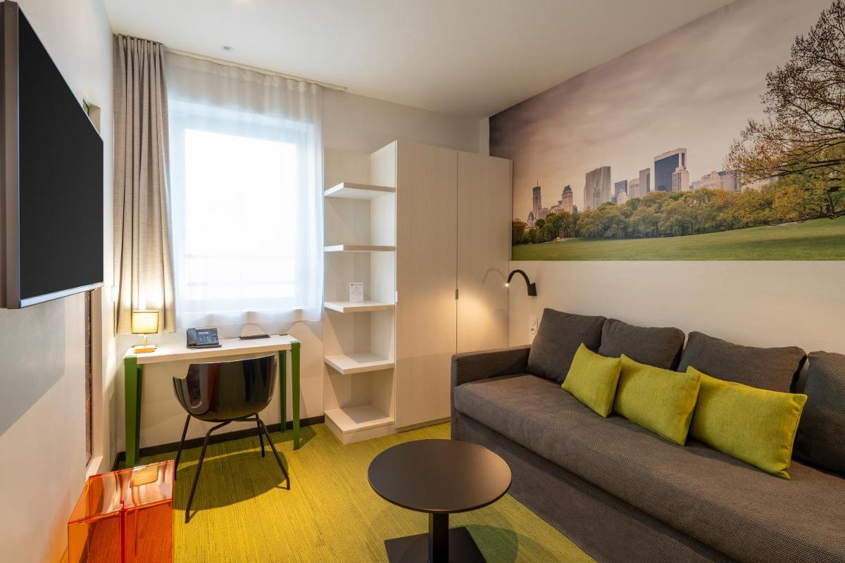 Télévision ou salle de divertissement dans l'établissement BW Plus Central Park Hotel & Spa