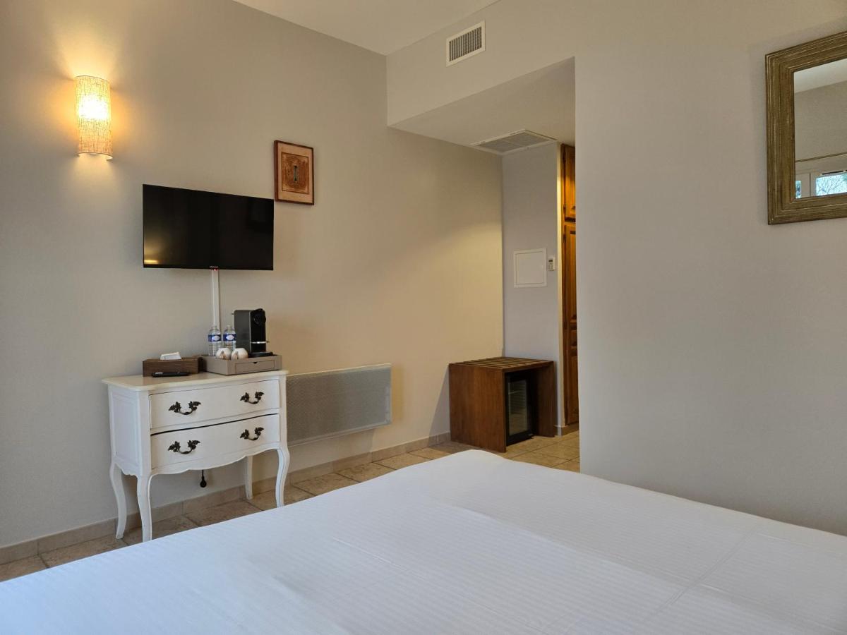 Un ou plusieurs lits dans un hébergement de l'établissement CÉRÈS - Boutique-Hôtel & Spa