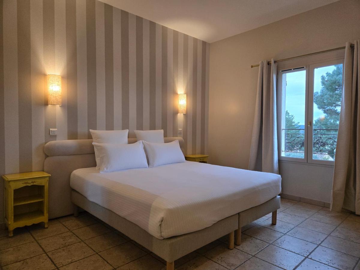 Un ou plusieurs lits dans un hébergement de l'établissement CÉRÈS - Boutique-Hôtel & Spa