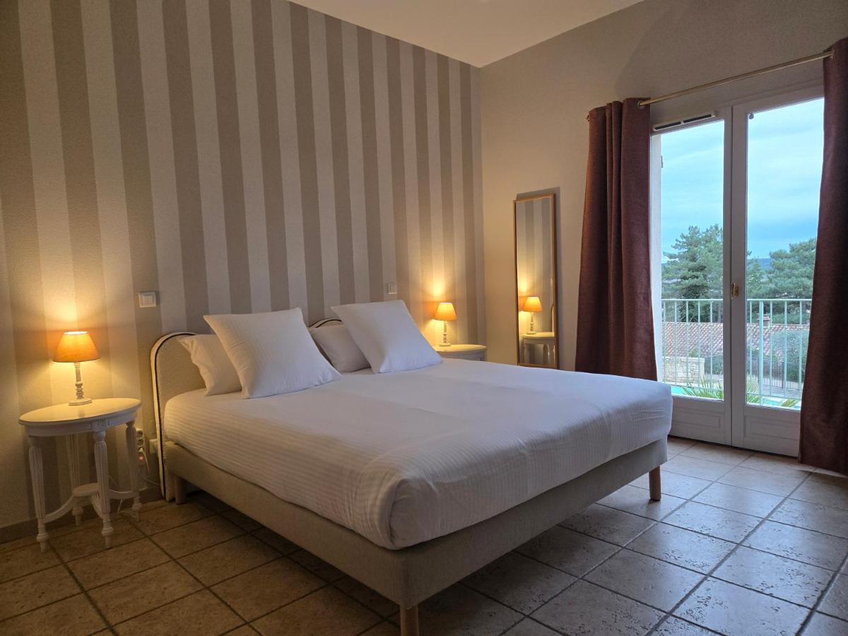 Un ou plusieurs lits dans un hébergement de l'établissement CÉRÈS - Boutique-Hôtel & Spa