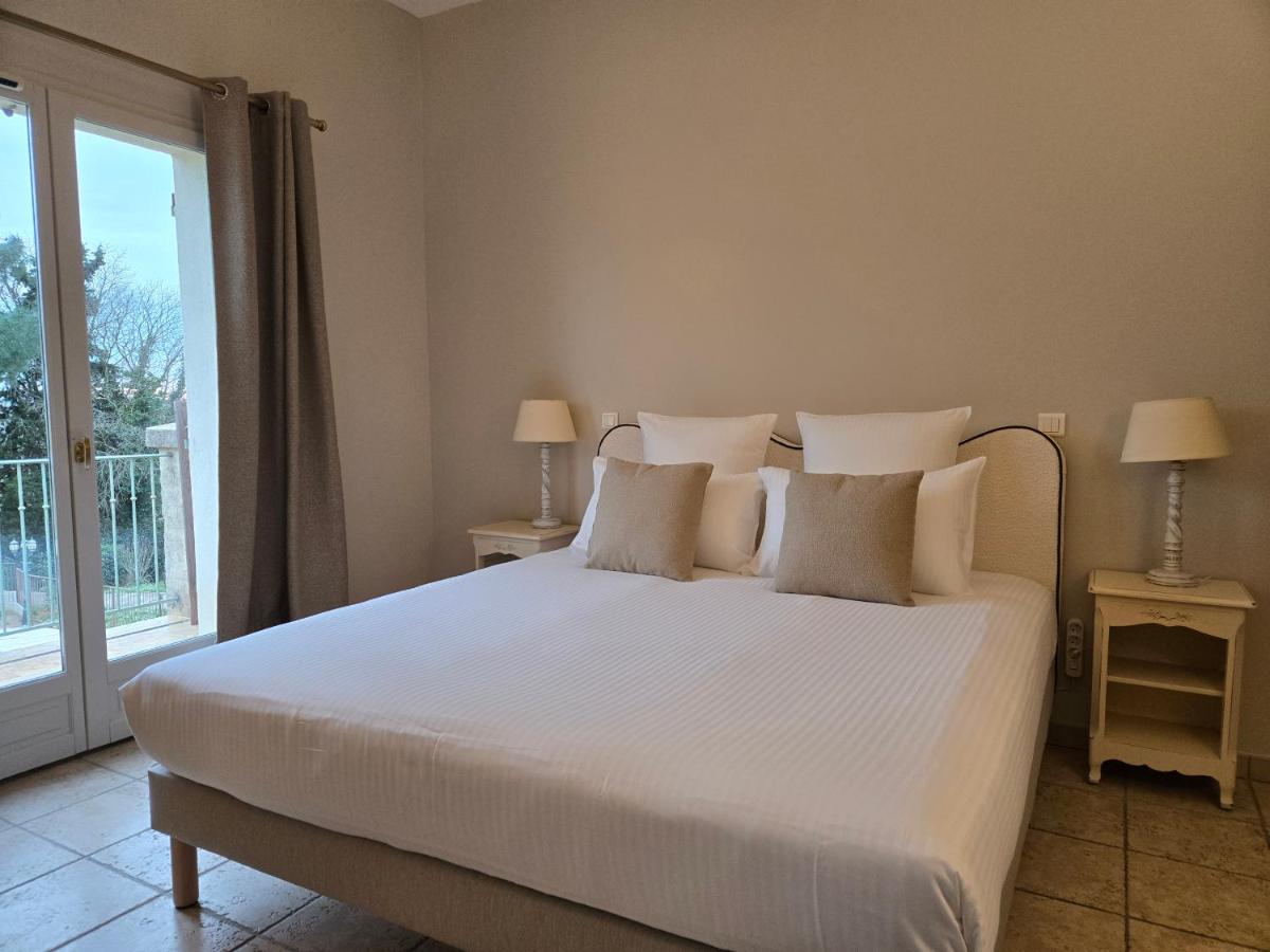 Un ou plusieurs lits dans un hébergement de l'établissement CÉRÈS - Boutique-Hôtel & Spa