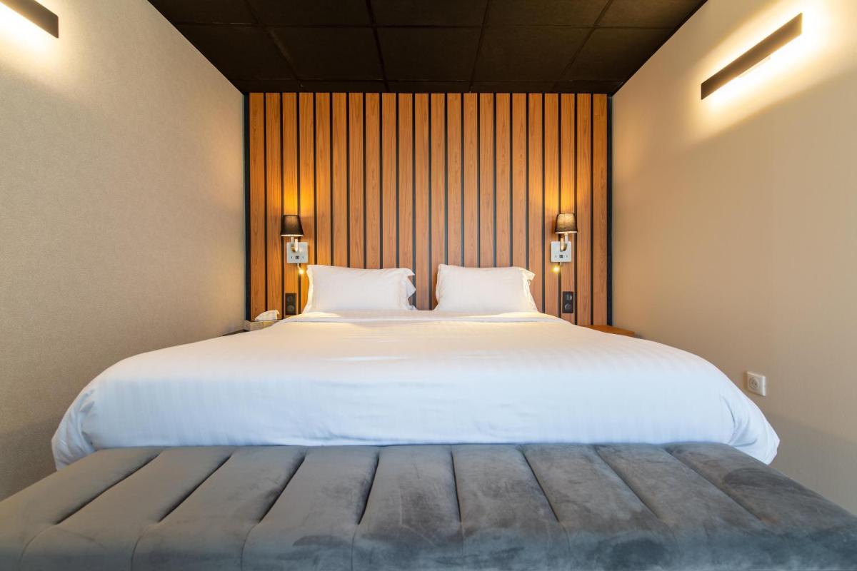 Un ou plusieurs lits dans un hébergement de l'établissement Best Western Côte des Sables Plouescat