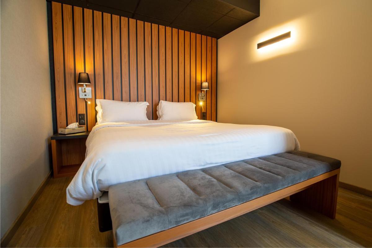 Un ou plusieurs lits dans un hébergement de l'établissement Best Western Côte des Sables Plouescat