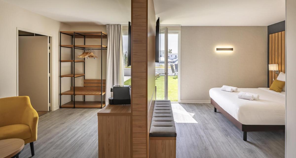 Un ou plusieurs lits dans un hébergement de l'établissement Best Western Côte des Sables Plouescat