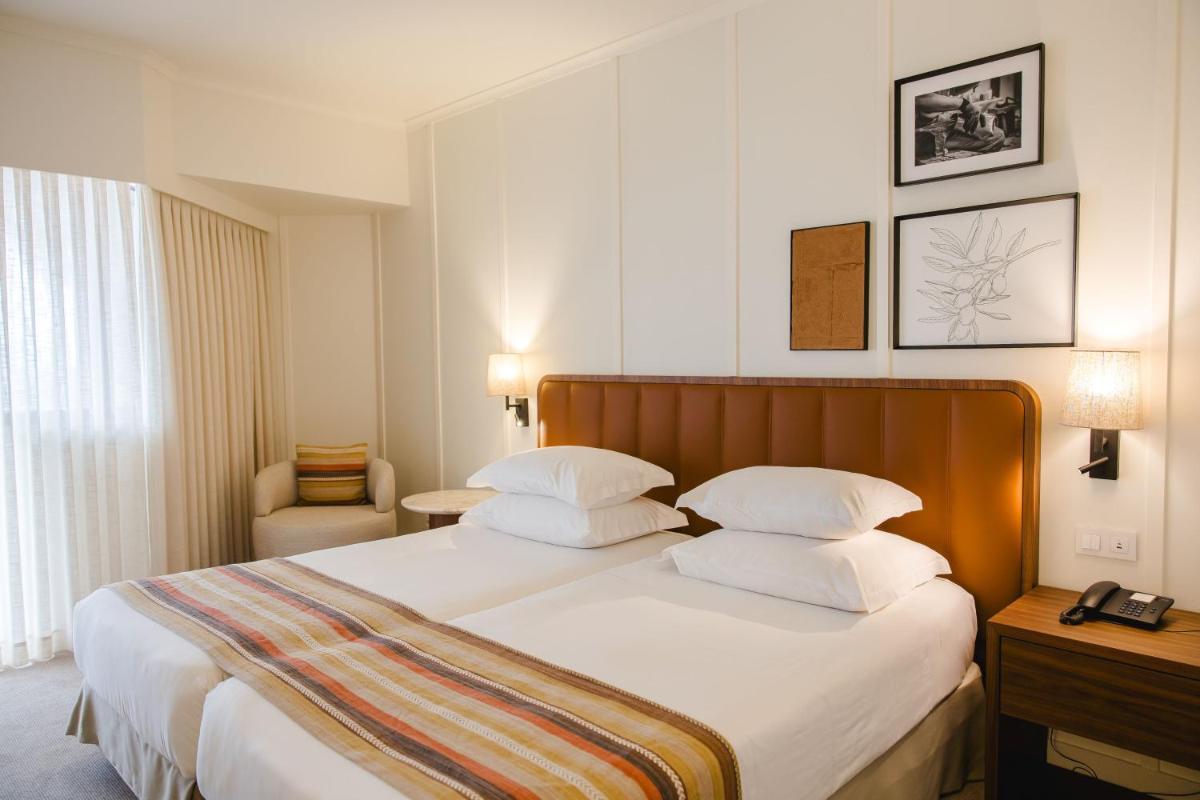 Uma cama ou camas num quarto em Evora Hotel