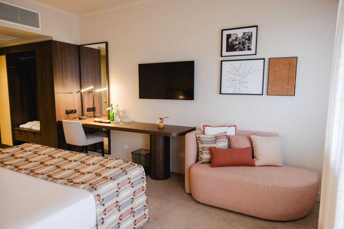 Uma área de estar em Evora Hotel