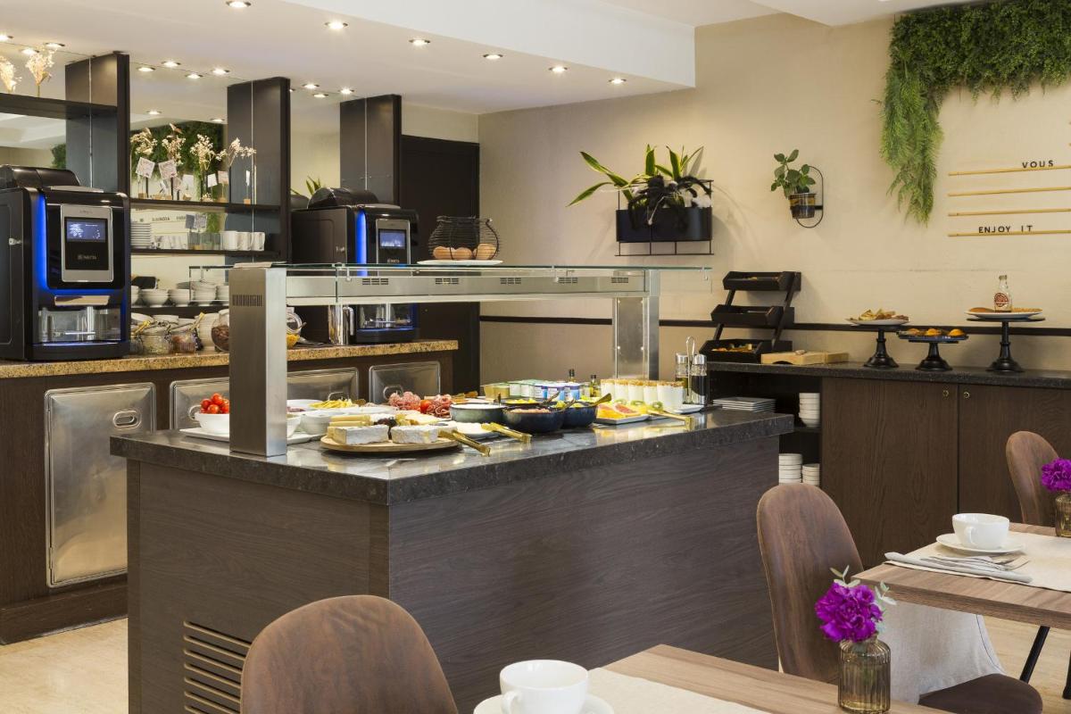 Cuisine ou kitchenette dans l'établissement Nehô Suites Cannes Croisette