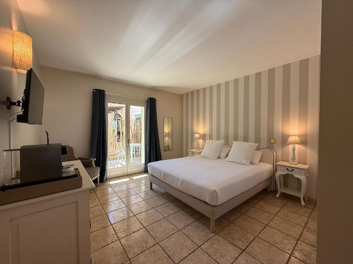 Un ou plusieurs lits dans un hébergement de l'établissement CÉRÈS - Boutique-Hôtel & Spa