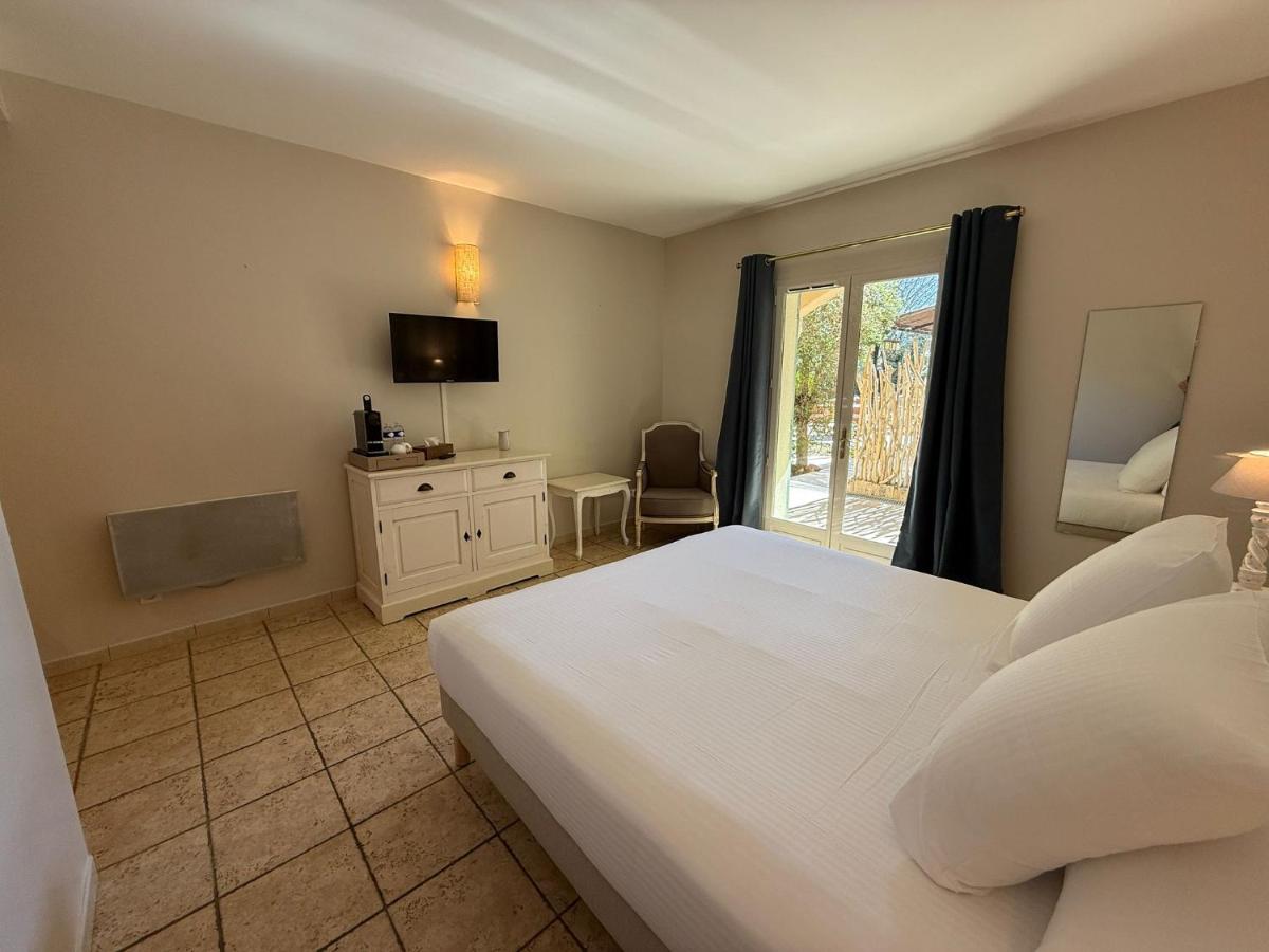 Un ou plusieurs lits dans un hébergement de l'établissement CÉRÈS - Boutique-Hôtel & Spa