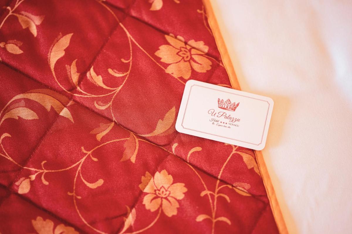 Un ou plusieurs lits dans un hébergement de l'établissement Hôtel U Palazzu & Spa