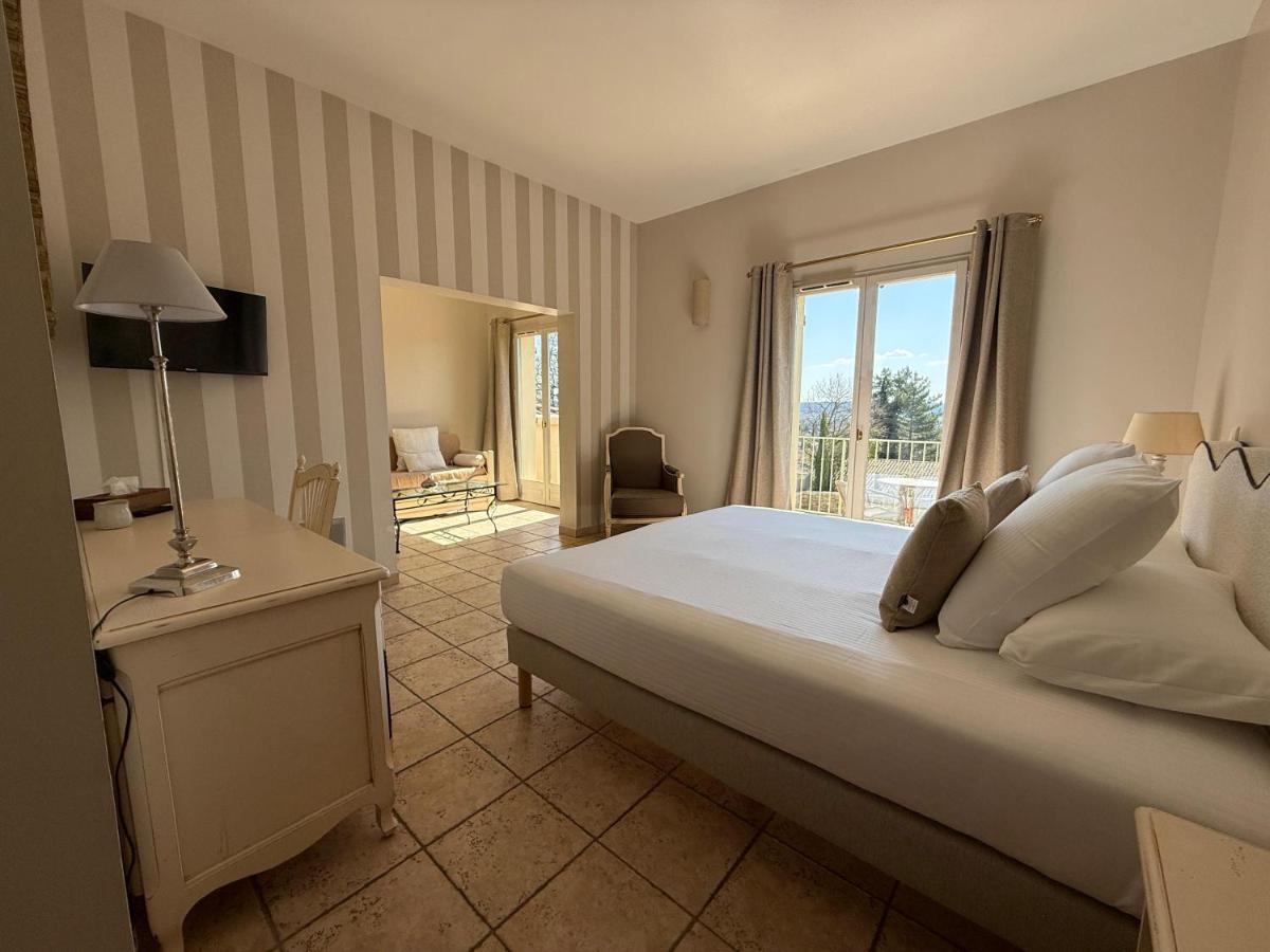 Un ou plusieurs lits dans un hébergement de l'établissement CÉRÈS - Boutique-Hôtel & Spa