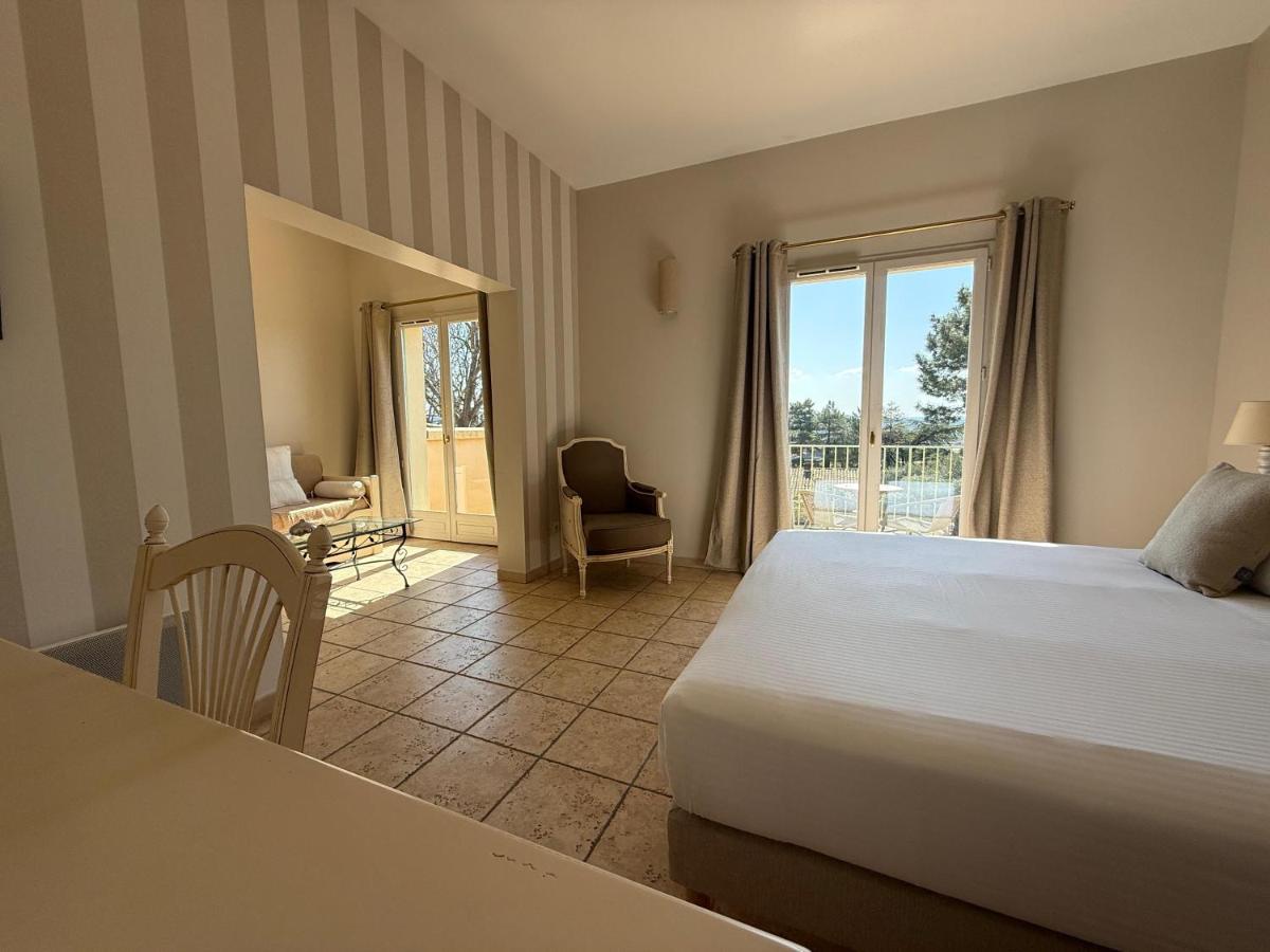 Un ou plusieurs lits dans un hébergement de l'établissement CÉRÈS - Boutique-Hôtel & Spa