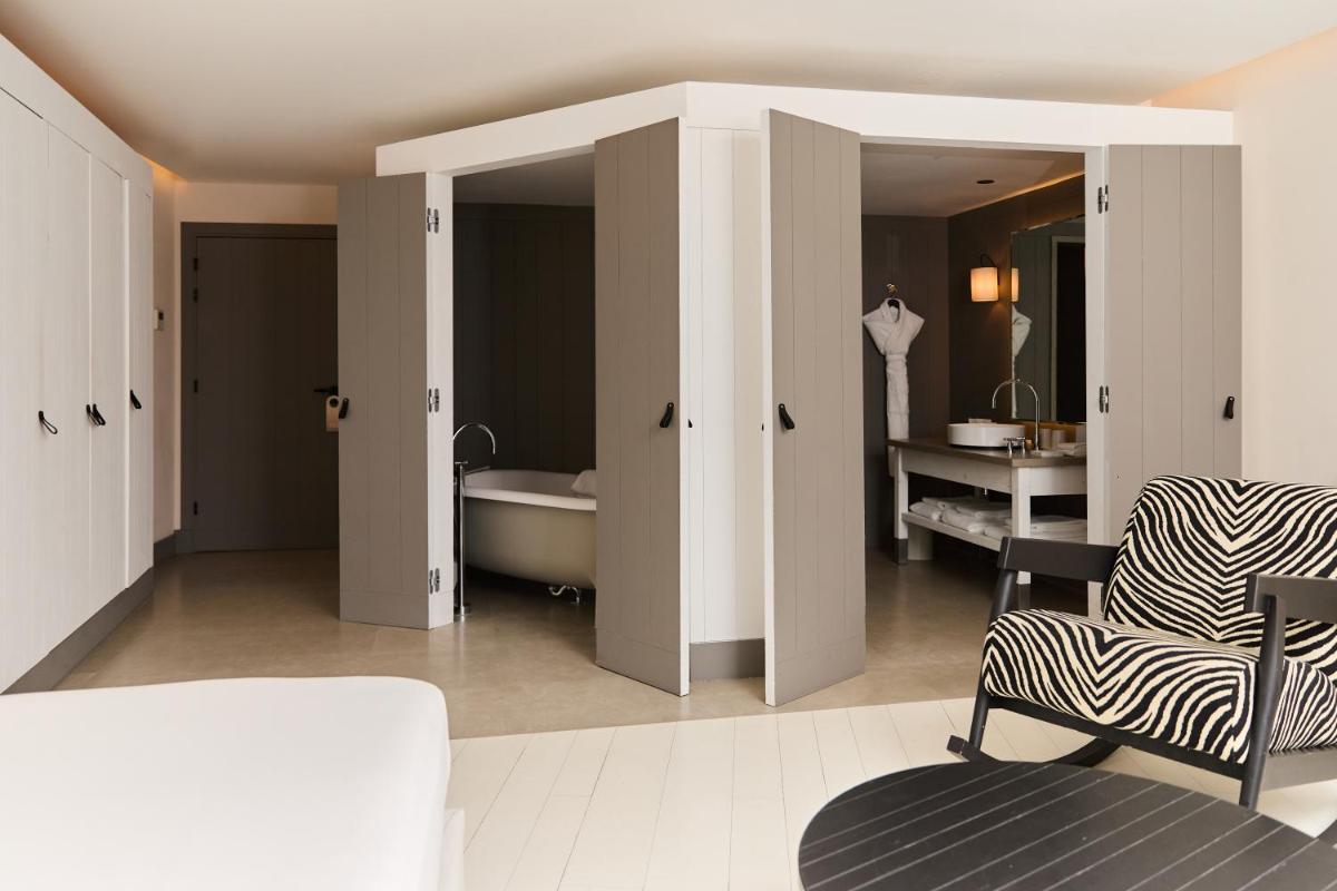 Un ou plusieurs lits dans un hébergement de l'établissement Hôtel Plage Palace & Spa