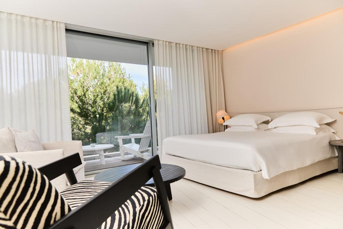 Un ou plusieurs lits dans un hébergement de l'établissement Hôtel Plage Palace & Spa