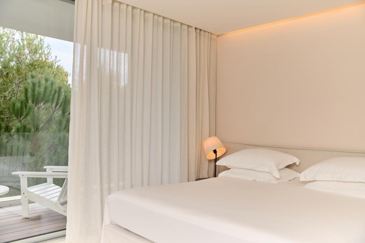Un ou plusieurs lits dans un hébergement de l'établissement Hôtel Plage Palace & Spa