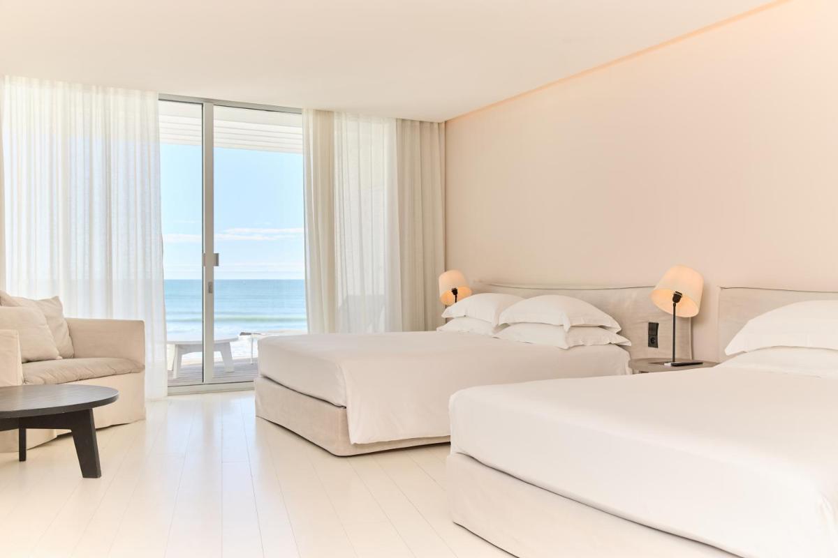 Un ou plusieurs lits dans un hébergement de l'établissement Hôtel Plage Palace & Spa
