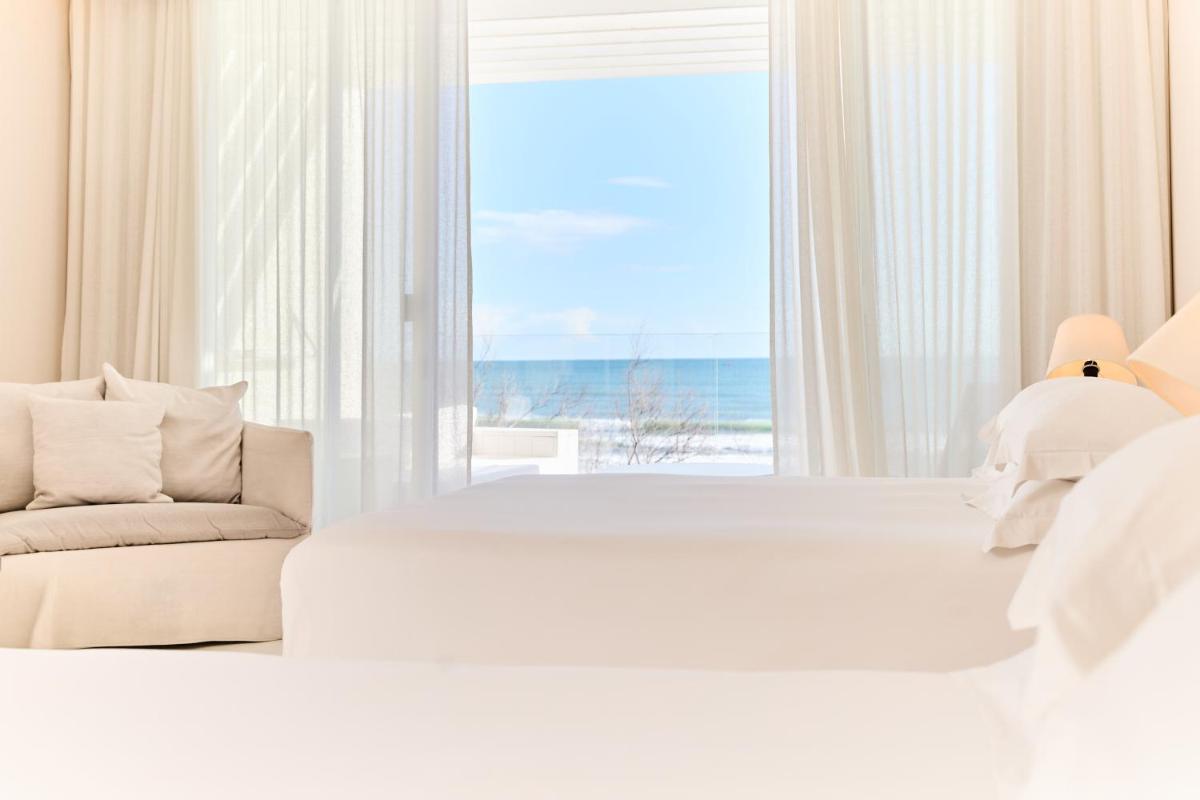 Un ou plusieurs lits dans un hébergement de l'établissement Hôtel Plage Palace & Spa