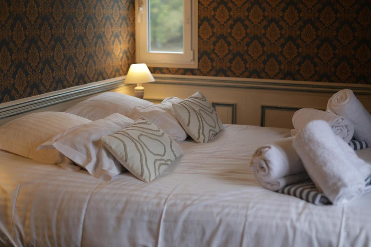 Un ou plusieurs lits dans un hébergement de l'établissement Chateau du boulay morin