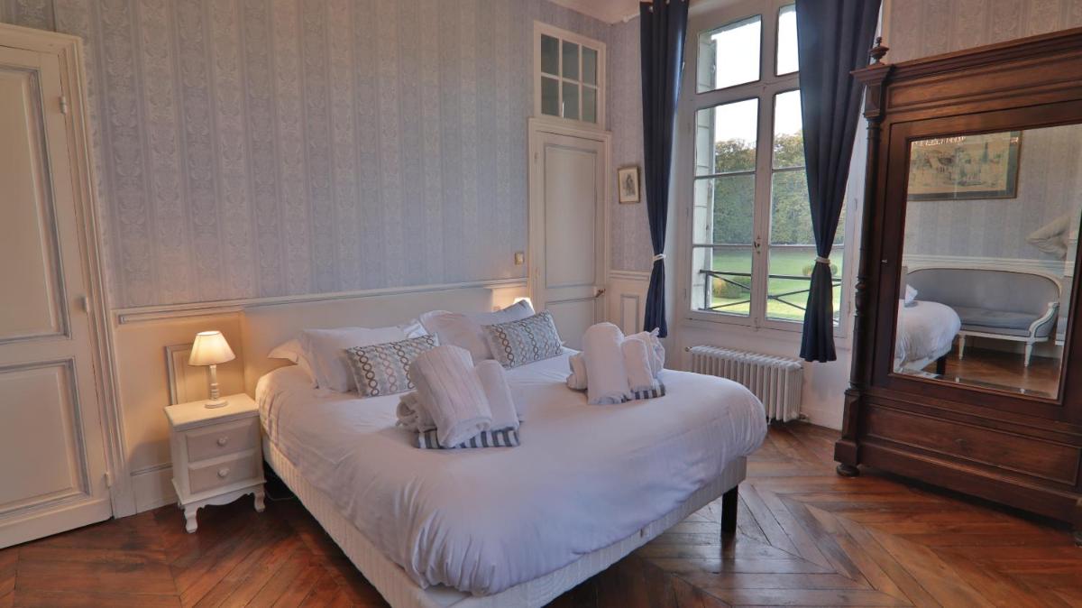 Un ou plusieurs lits dans un hébergement de l'établissement Chateau du boulay morin