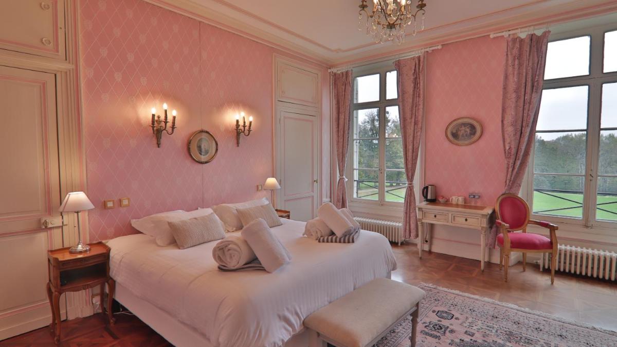 Un ou plusieurs lits dans un hébergement de l'établissement Chateau du boulay morin