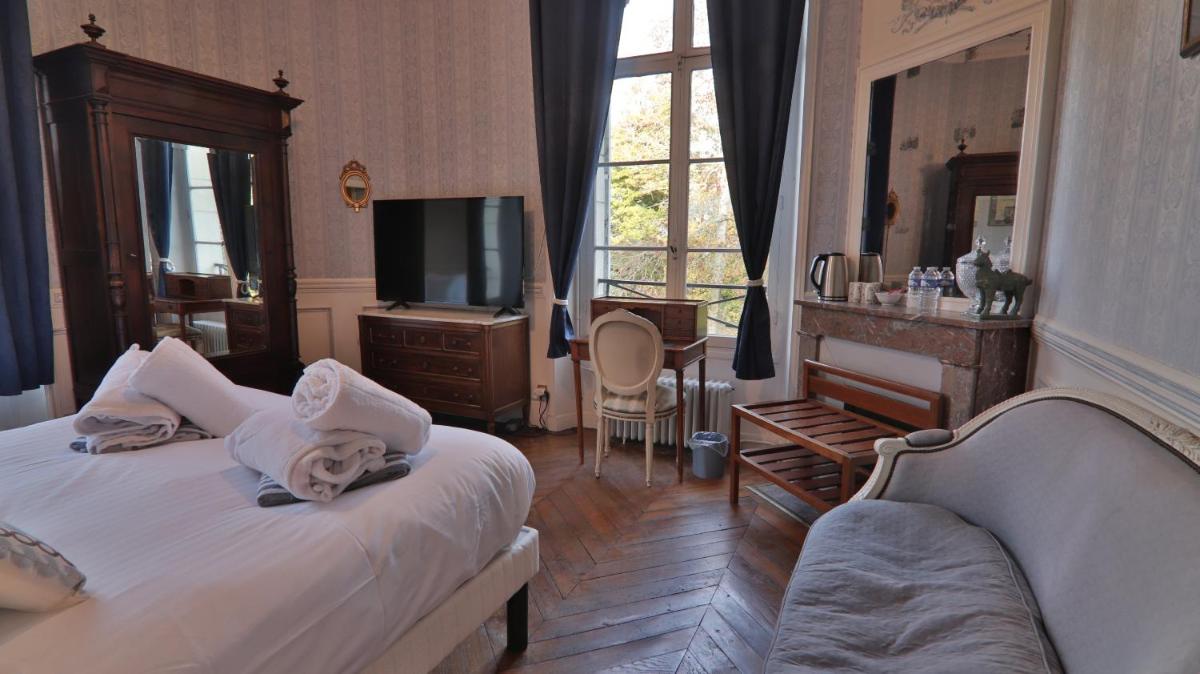 Un ou plusieurs lits dans un hébergement de l'établissement Chateau du boulay morin