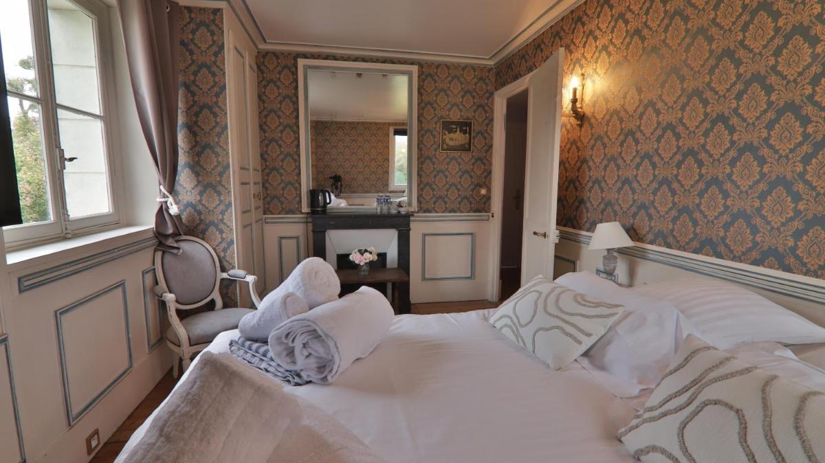 Un ou plusieurs lits dans un hébergement de l'établissement Chateau du boulay morin