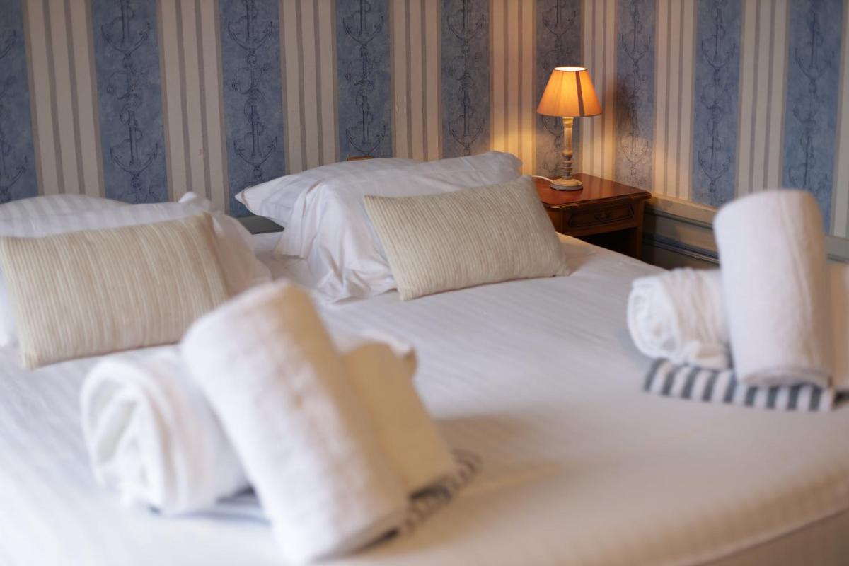 Un ou plusieurs lits dans un hébergement de l'établissement Chateau du boulay morin