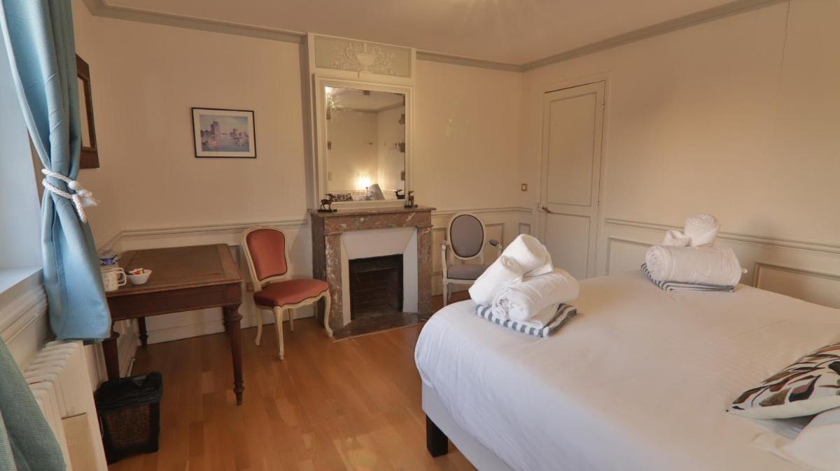 Un ou plusieurs lits dans un hébergement de l'établissement Chateau du boulay morin
