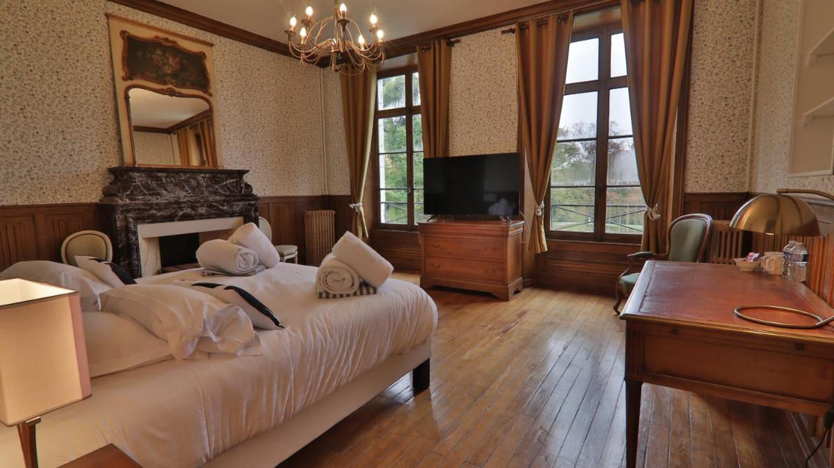 Un ou plusieurs lits dans un hébergement de l'établissement Chateau du boulay morin