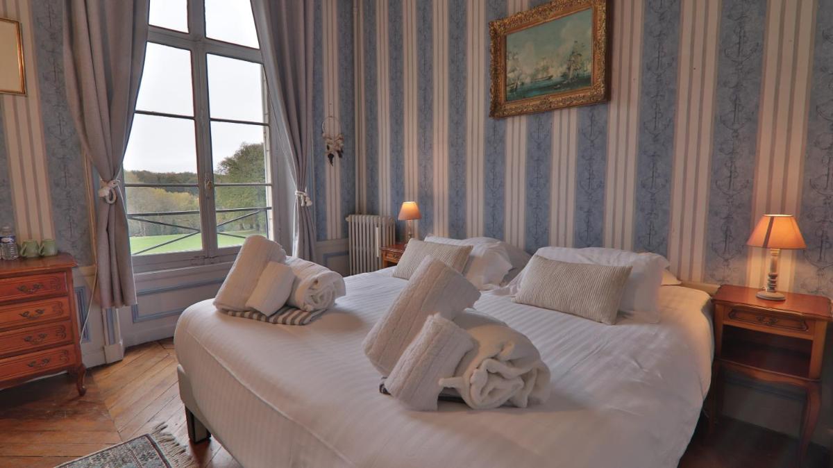 Un ou plusieurs lits dans un hébergement de l'établissement Chateau du boulay morin