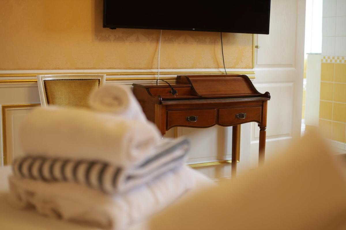 Télévision ou salle de divertissement dans l'établissement Chateau du boulay morin